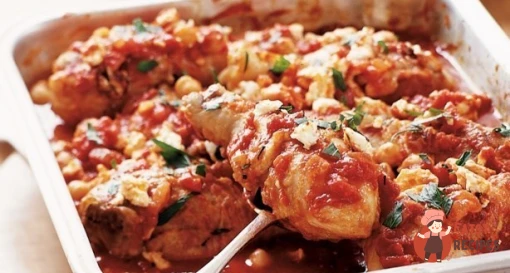 Курка в томаті з нутом