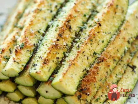 Кабачки, запечені з сиром та пряними травами