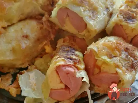 Сосиски з сиром у капусті