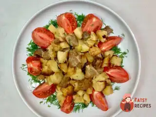 Індичка з картоплею та цибулею, запечена в духовці