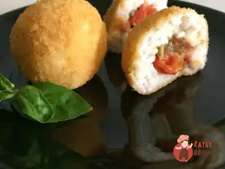 Аранчіні (Alla puttanesca)