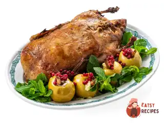 Качка в духовці з яблуками та квашеною капустою