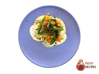 Тріска з картопляним пюре та соусом із часнику