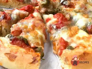 Піца з шинкою та печерицями