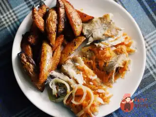 Зубатка, запечена з овочами