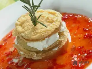 Смажені зелені помідори в паніровці