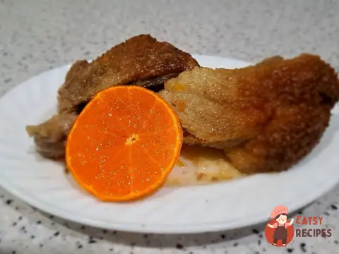 Качка з мандаринами в рукаві