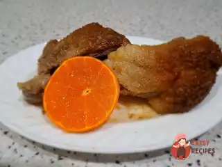 Качка з мандаринами в рукаві
