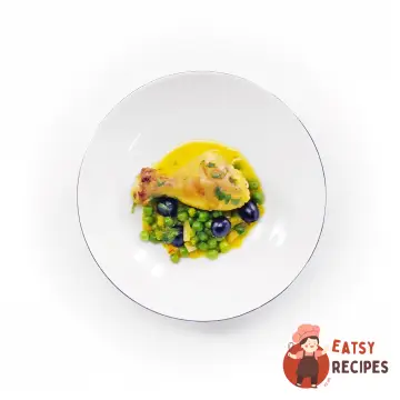 Курячі гомілки з шафраном, оливками та горошком