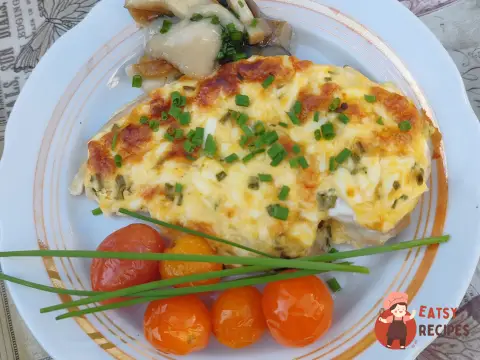 Курка в духовці під сирною шапочкою