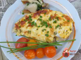 Курка в духовці під сирною шапочкою