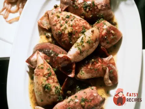 Кальмари, фаршировані грибами та сиром