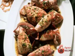 Кальмари, фаршировані грибами та сиром