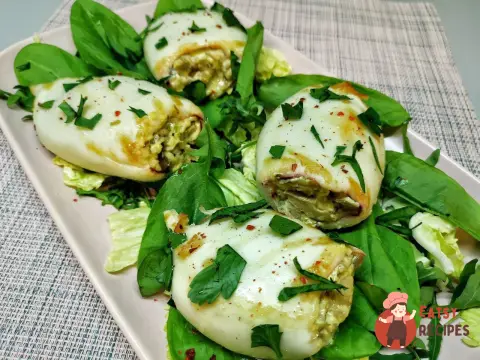 Кальмари фаршировані грибами з сиром