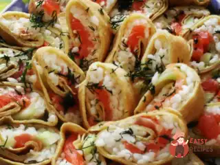 Роли з млинців з вершковим сиром, сьомгою та авокадо