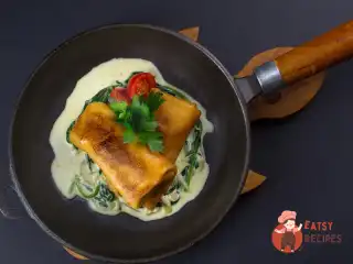 Млинці з м'ясом та вершково-шпинатним соусом