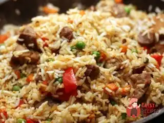 Рис зі свининою та овочами