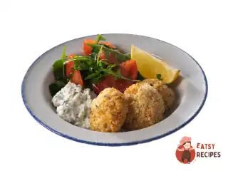 Крабкейки з соусом тартар та зеленим салатом