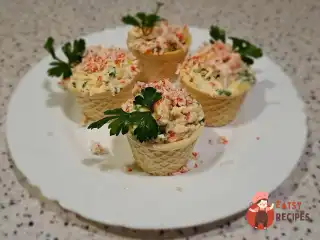 Тарталетки з плавленим сиром і крабовими паличками