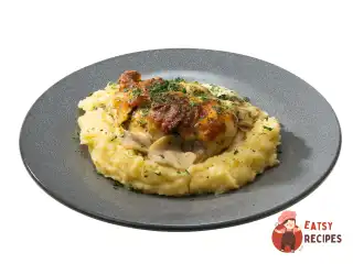 Курка з грибами в духовці