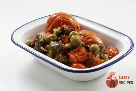Курячі серця на сковороді із запеченими томатами