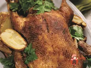 Качка з яблуками та соусом із потрухів