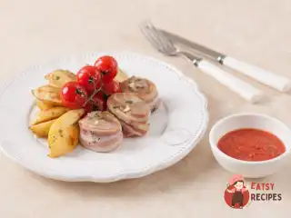 Турнедо зі свинини з запеченою картоплею та томленими у прованських травах томатами чері