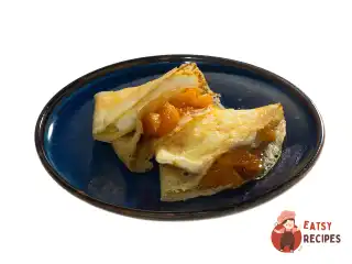 Млинці з мандариновим мармеладом, маскарпоне та згущеним молоком