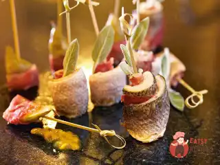 Рулети з сибаси з прошутто.