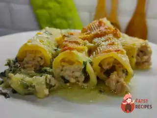 Трубочки (канеллоні) з фаршем на подушці з картоплі та шпинату