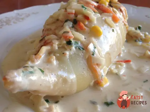 Кальмари, фаршировані овочами з крабовими паличками