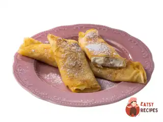 Млинці з родзинками, сиром та апельсиновою цедрою