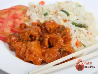 Солодкі курячі грудки у фритюрі із зеленою цибулею, рисовим вином та цедрою апельсину.