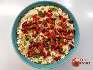 Кускус із сирним сиром та в'яленими томатами