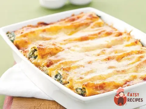 Каннеллоні паста з овочами з сиром і соусом бешамель