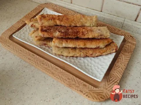 Палички з шинкою та сиром на сковороді