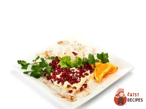 Салат з курки з апельсинами та гранатом.