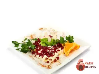 Салат з курки з апельсинами та гранатом.