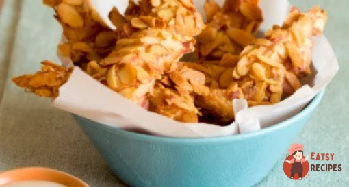 Курячі шматочки в паніруванні з мигдалю з коричневим рисом