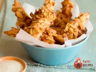 Курячі шматочки в паніруванні з мигдалю з коричневим рисом