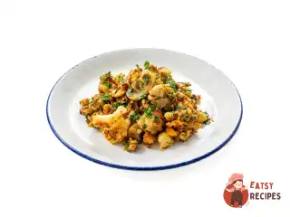 Теплий салат зі смажених грибів із цвітною капустою