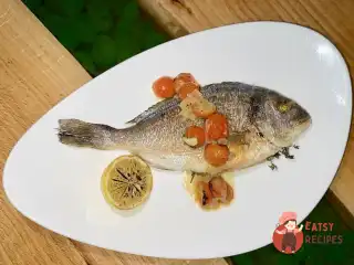 Дорада на грилі з травами