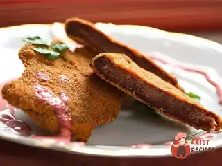 Телятина в пармезані та розмарині