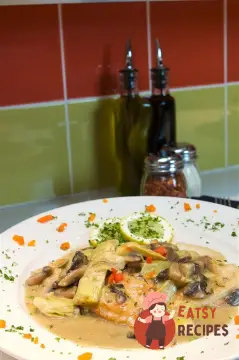 Курка у вершковому соусі з грибами