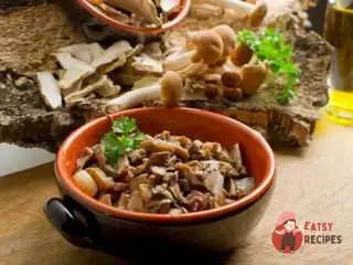 Запечені гриби з часником та травами