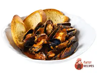 Мідії в томатному соусі