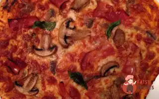 Піца З Шинкою, Молюсками Та Анчоусами