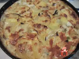 Запечена картопля з оселедцем