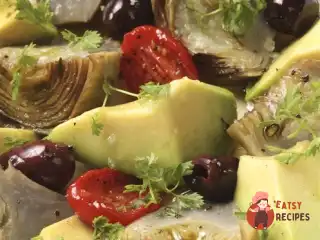 Молоді артишоки з авокадо, таджарськими оливками та томатами «Дотерно»