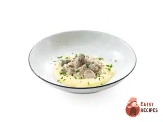 Курячі сердечка у сметані